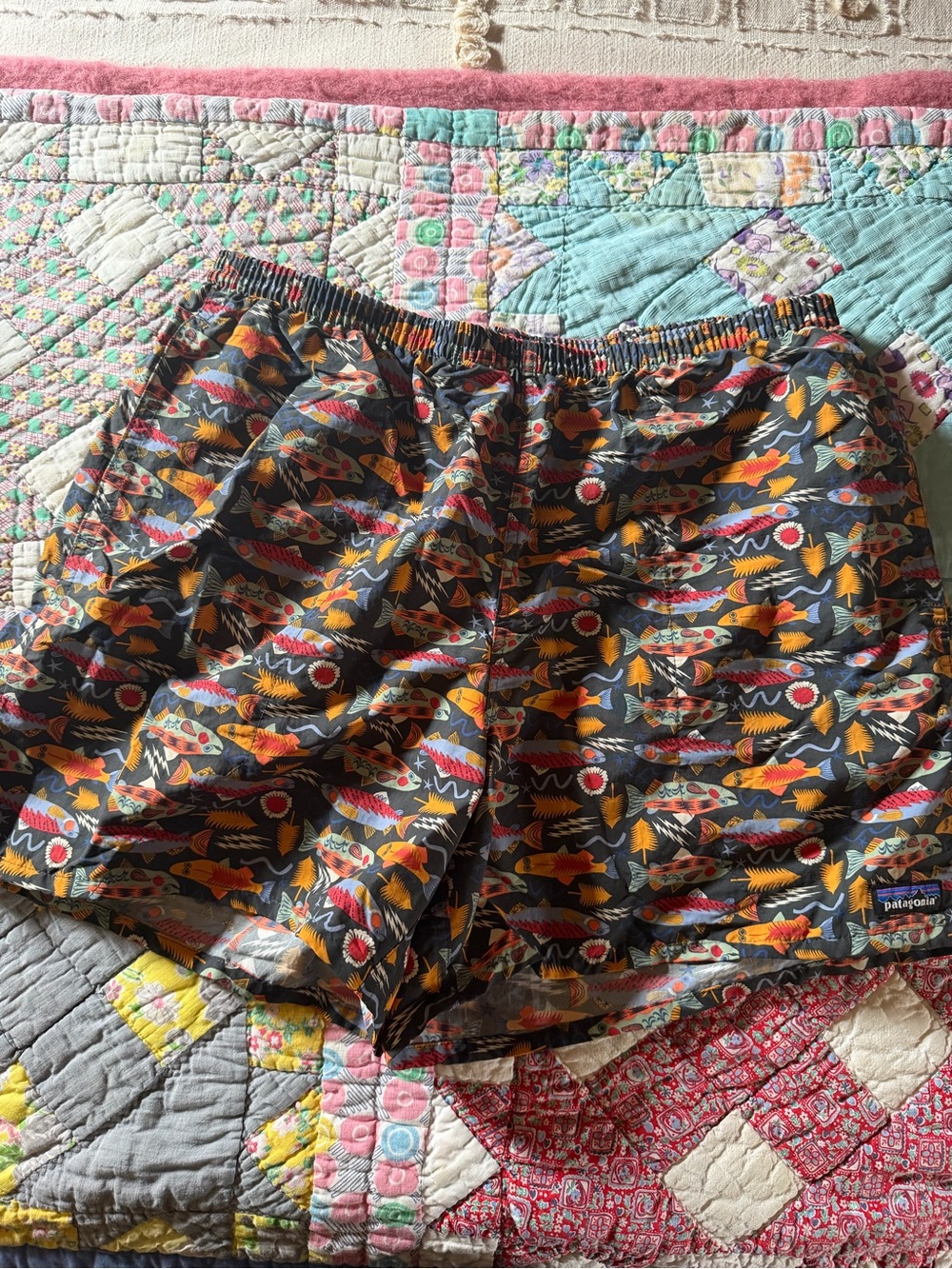 Patagonia Men’s Shorts — Black with Orange, Yellow, Red and White Fish Print